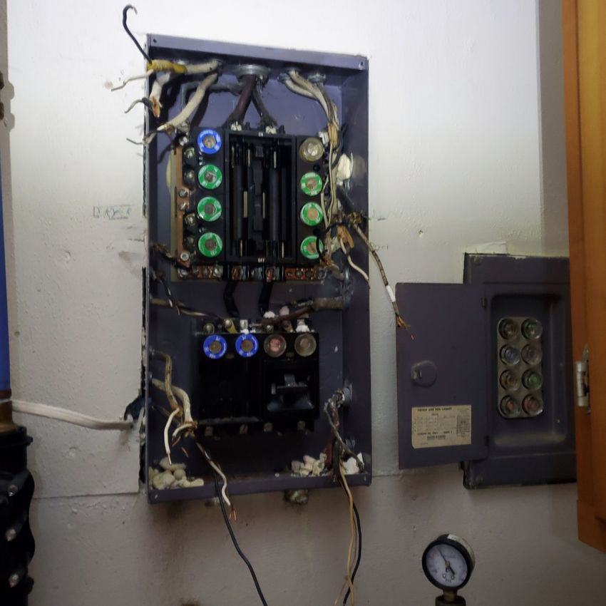 Old fuse panel before a service upgrade by McClone Electric in Warsaw, Indiana