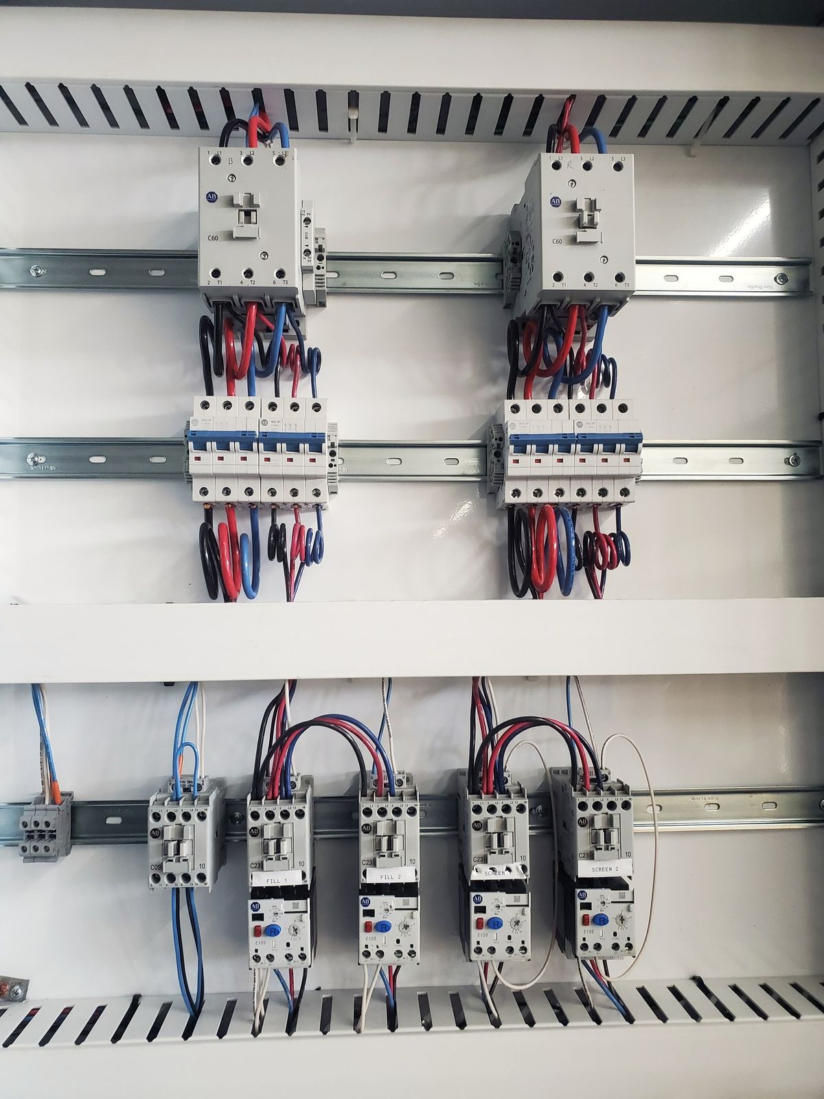 Motor starters and overload relays inside a control panel built by McClone Electric