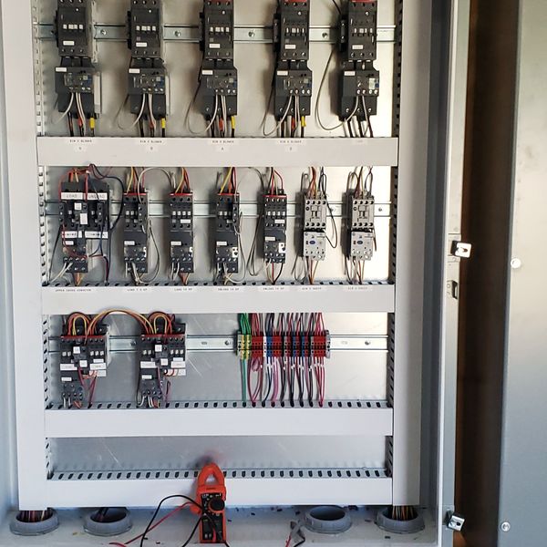 Labeled motor circuits in a grain handling control panel built by McClone Electric