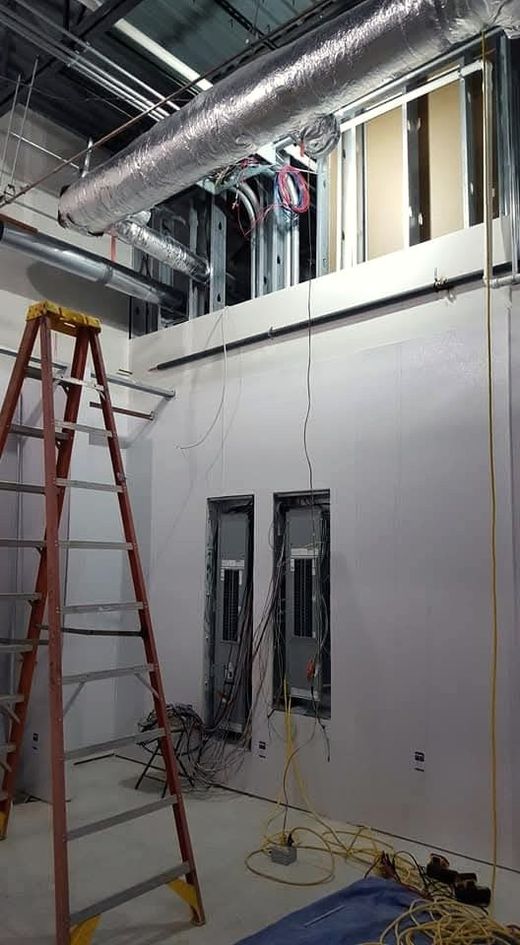 Electrical panels being terminated by McClone Electric during the fit-out at Moe’s Southwest Grill in Warsaw, Indiana