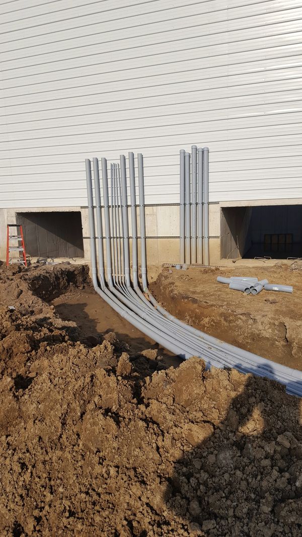 Service conduit runs entering a new commercial building in Warsaw, Indiana, installed by McClone Electric